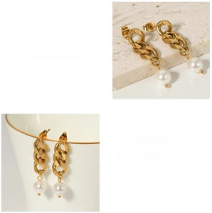 Detailed view of 18K gold plated chain earrings with white pearls on a stone surface