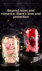 Close-up of preserved soap roses in a glass dome with LED lights and Just for you ribbon