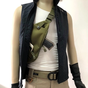 Tactical green chest bag detail showing quick-access compartment for concealed carry storage