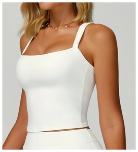 Close-up of white slim yoga tank top with square neck and high-elastic knit fabric