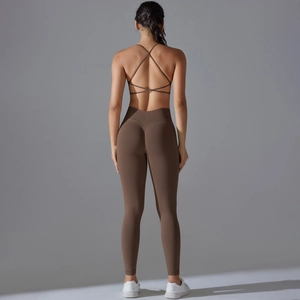 Detail of back view showing seamless cross-strap sports bra and high-waisted yoga leggings