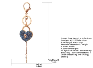 Detail of rose gold heart lock keychain with blue rhinestones and dimensions shown