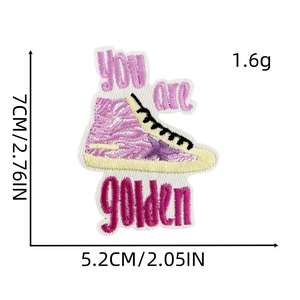 Detail view of pink sneaker embroidery patch with Golden text and size measurements