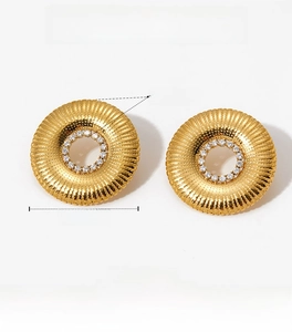 Detailed view of gold sunburst earrings with outer 25mm diameter and central zircon inlays