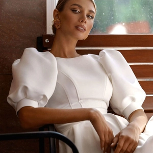 Elegant white satin wedding dress with puff sleeves and crew neck for formal events