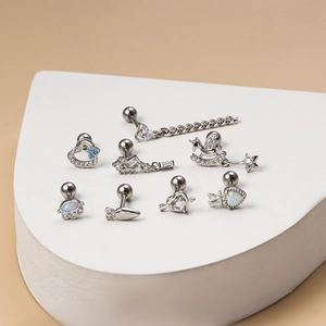 Surgical steel stud earrings set with heart unicorn and blue zircon butterfly motifs
