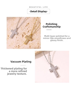 Close-up of gold and silver cross pendants with micro-paved sparkling cubic zirconia