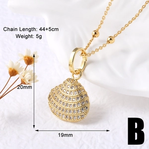 Detail of gold shell pendant necklace with zircon inlay and product dimension specifications