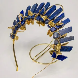 Detail of lapis lazuli crystals and golden metal leaves on the bohemian crown headband