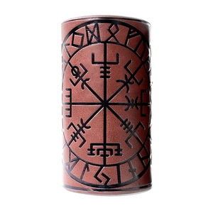 Macro detail of brown leather wristband with embossed Viking compass and Nordic runes