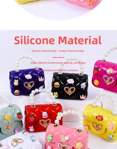 Array of colorful silicone mini bags with pearl handles and heart shaped twist locks