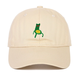 Cream cotton baseball cap featuring a cute green embroidered frog on the front crown