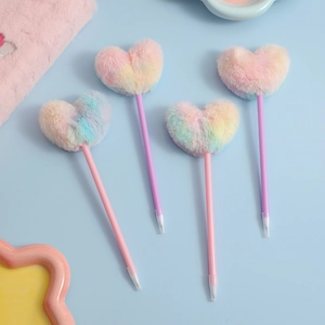 Detail of four fluffy rainbow heart ballpoint pens with gradient pastel faux fur toppers