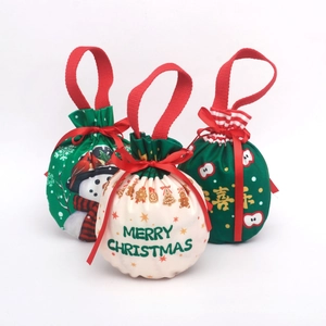Three-piece drawstring Christmas gift bags with snowman and gingerbread man prints