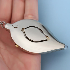 Close-up of leaf-shaped personal alarm in silver finish with LED light and keychain