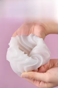 Detailed view of flexible wave texture silicone mold being squeezed to show high elasticity