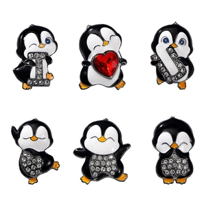 Set of six cartoon penguin enamel pins with rhinestones and a red heart jewel decoration