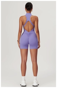 Detail of purple yoga jumpsuit featuring racerback design and scrunch butt lifting texture