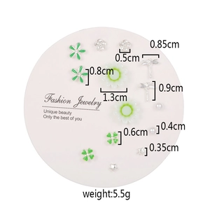 Detailed view of a 7-pair stud earring set with dimensions and weight on a pink card