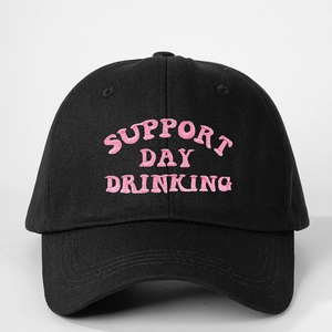 Close-up of pink SUPPORT DAY DRINKING embroidery on black cotton baseball cap