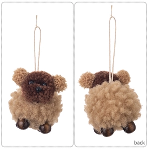 Front and back detail of a plush felt dog ornament with wooden beads and white hanging loop