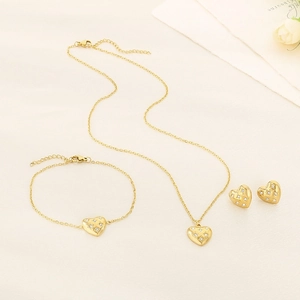 Elegant gold stainless steel heart jewelry set with necklace bracelet and earrings