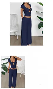 Detail view of navy short sleeve crop top and high waist wide leg pants set in ribbed fabric