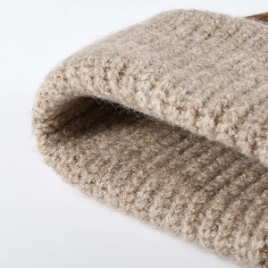 Warm winter wool beanie for women featuring a thick knitted texture and folded cuff