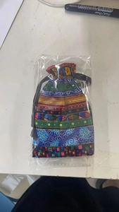 Ethnic pattern drawstring storage bag for hair accessories in clear plastic packaging