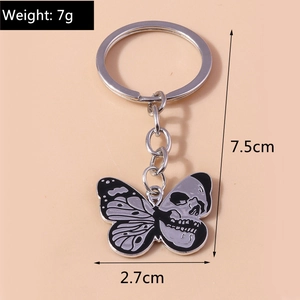 Detail view of skeleton butterfly keychain with 7g weight and 7.5cm size dimensions