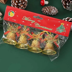 Set of four gold Christmas bell ornaments on dark green festive background