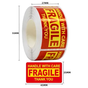 Detailed view of 45x25mm fragile warning labels showing red background and yellow text
