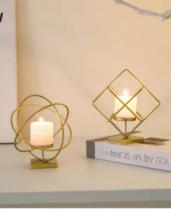 Detail of geometric gold metal candle holder with round and diamond frames for table decor