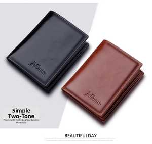 Detailed close-up showing black and brown leather wallets with refined stitching and embossed logo