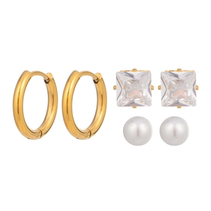 Three-pair earring set featuring gold hoops, zircon studs, and white pearls on a white background
