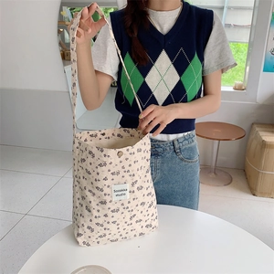 Floral canvas tote bag with purple flower pattern and shoulder strap for daily casual use