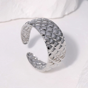 Polished silver stainless steel open ring with quilted diamond pattern design