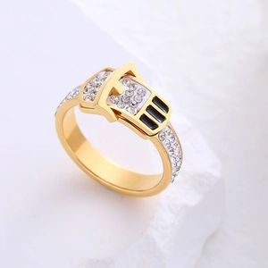 Luxurious 18k gold belt buckle ring with sparkling diamonds and black enamel accents