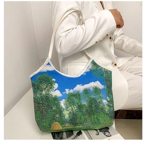 Artistic oil painting tote bag shown with model in white suit for minimalist style