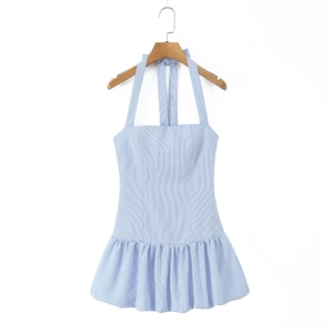 Detail of light blue striped halter dress with a ruffle hem on a wooden hanger