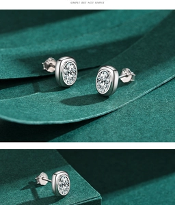 Detail of S925 sterling silver stud earrings with oval-cut cubic zirconia settings