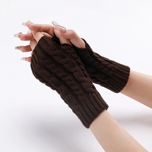 Detail showing the cable knit pattern and stretch of dark brown fingerless arm warmers