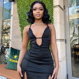 Detailed close-up of a black bodycon dress with eyelash lace trim and side slits