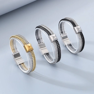 Detail view of woven fish scale bracelets in gold, black and silver stainless steel