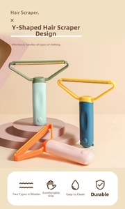 Detail of Y-shaped manual hair scraper with double-sided blade and bear handle design