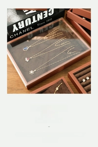 Detail view of premium brown PU leather jewelry tray with soft velvet lining and glass lid