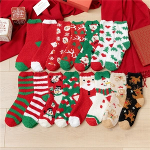 Christmas coral fleece warm socks with festive patterns like Santa and reindeer in a gift set