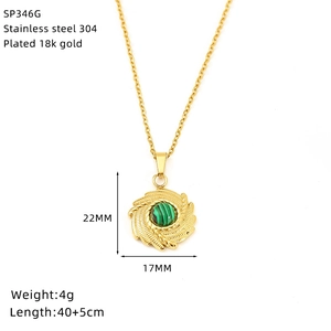 Detail of 18K gold plated stainless steel pendant featuring green stone inlay