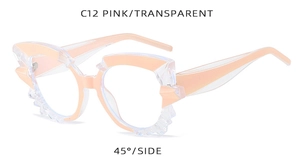 Detail view of pink and transparent geometric sunglasses frame with 45-degree angle