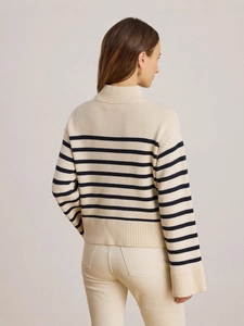 Women's striped knit sweater in cream and navy blue with a cozy mock neck design